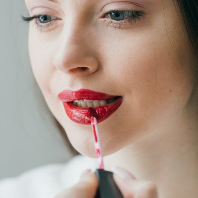 closeup-shot-of-woman-paint-her-lips-by-cosmetic-b-V6AQL6T